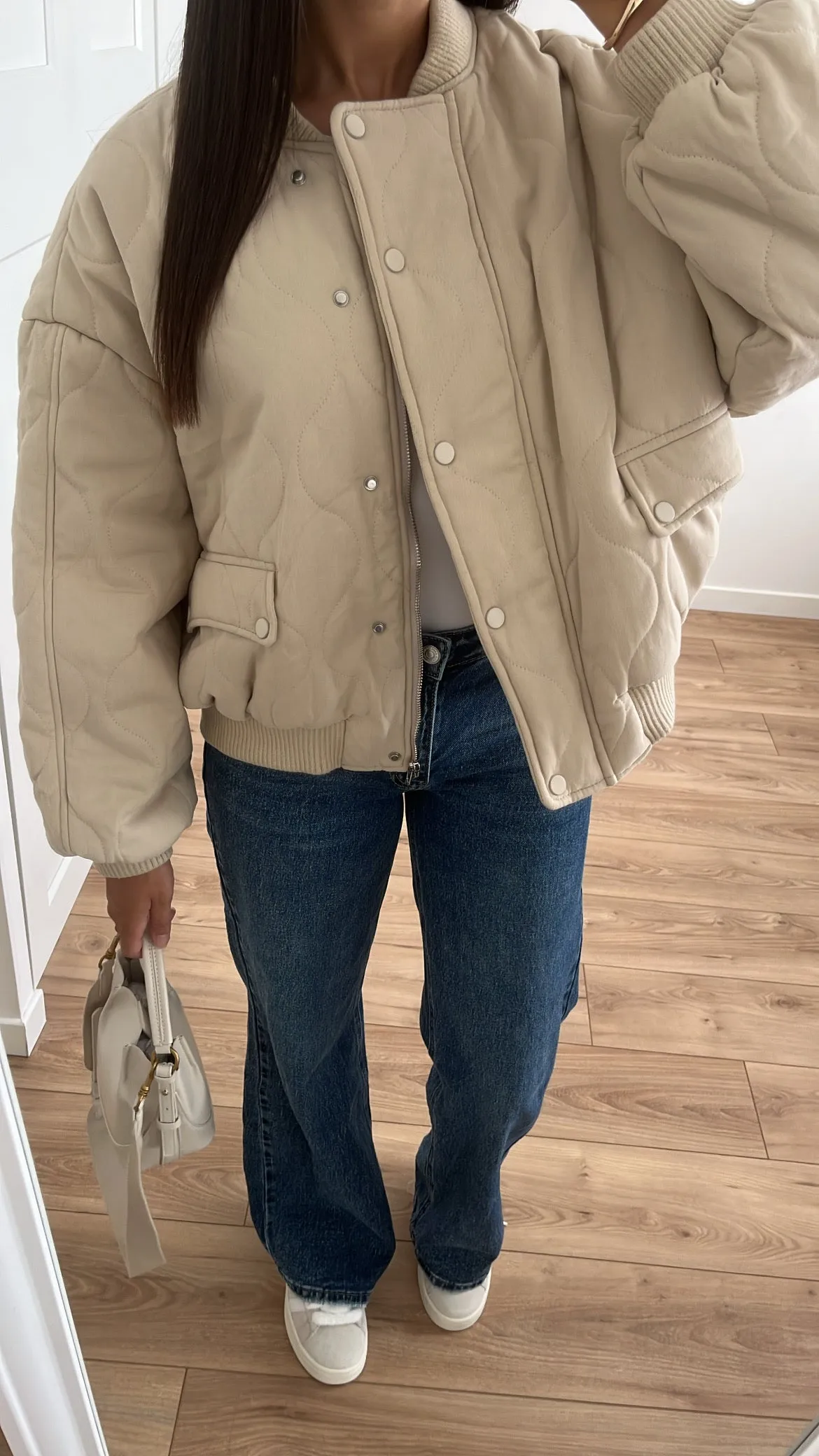 Beige quilted bomber jacket