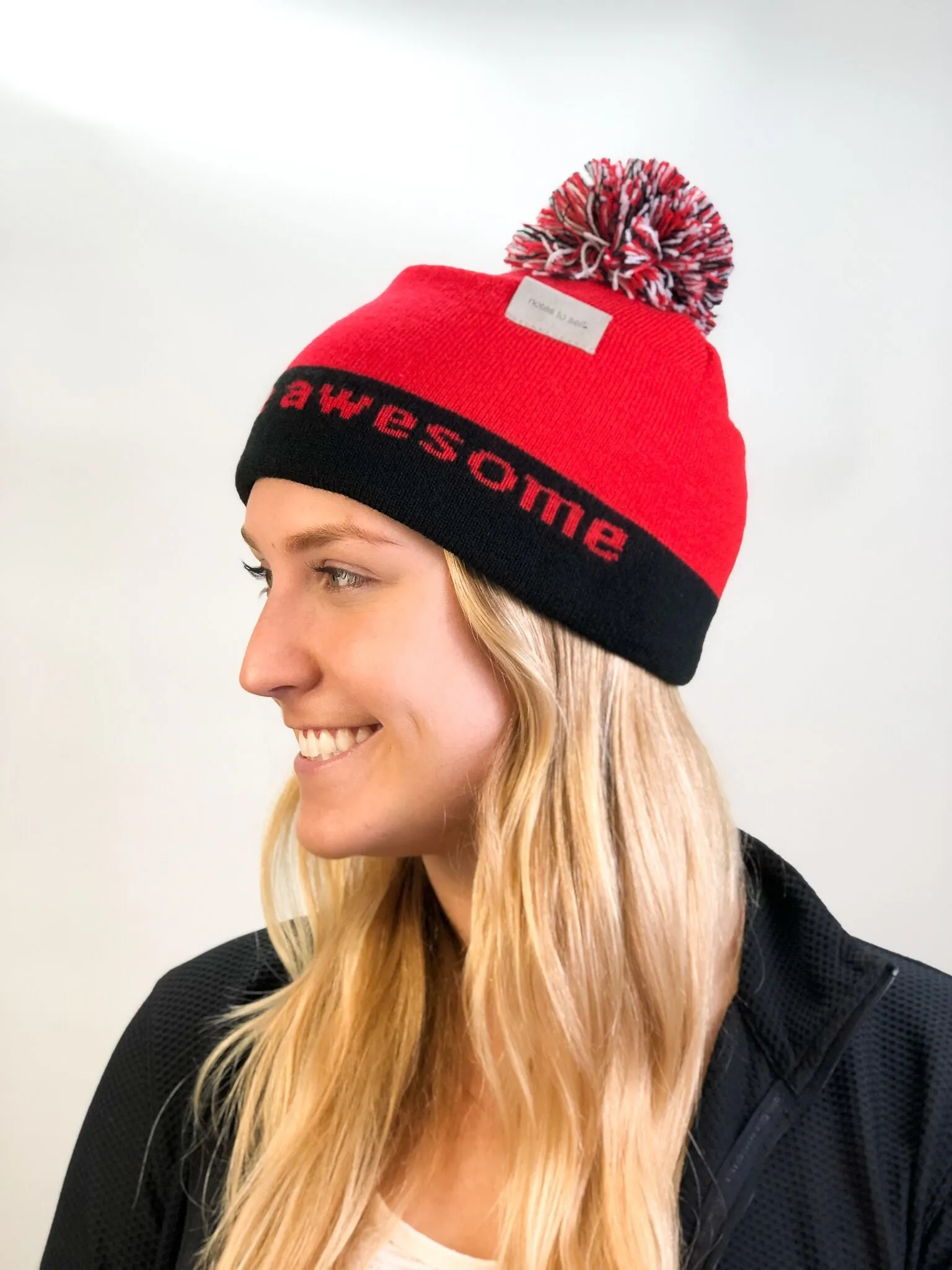 I believe™ red & black knit beanie with We are awesome™ on inside cuff