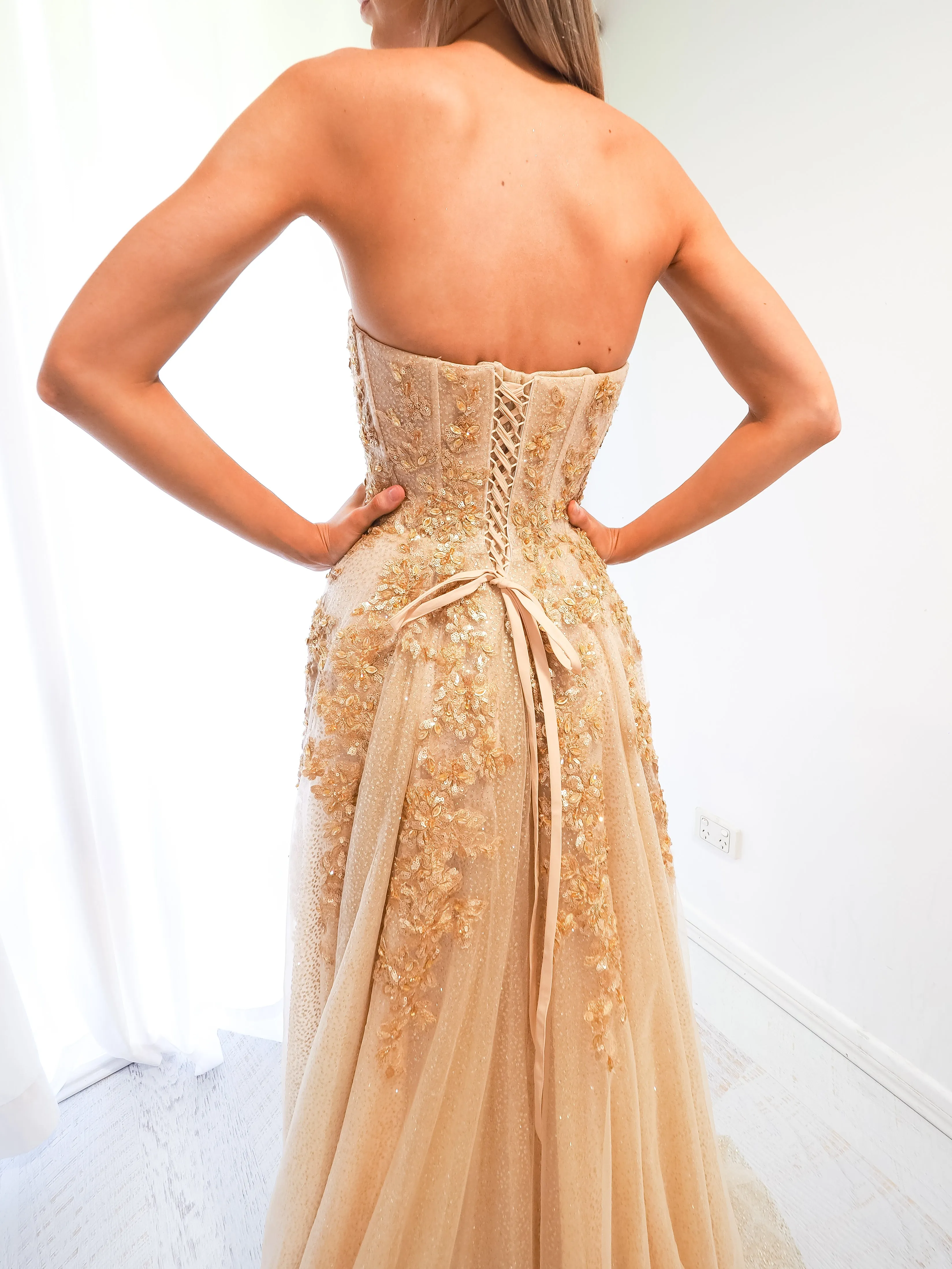 Sparkling gold bustier dress for hire