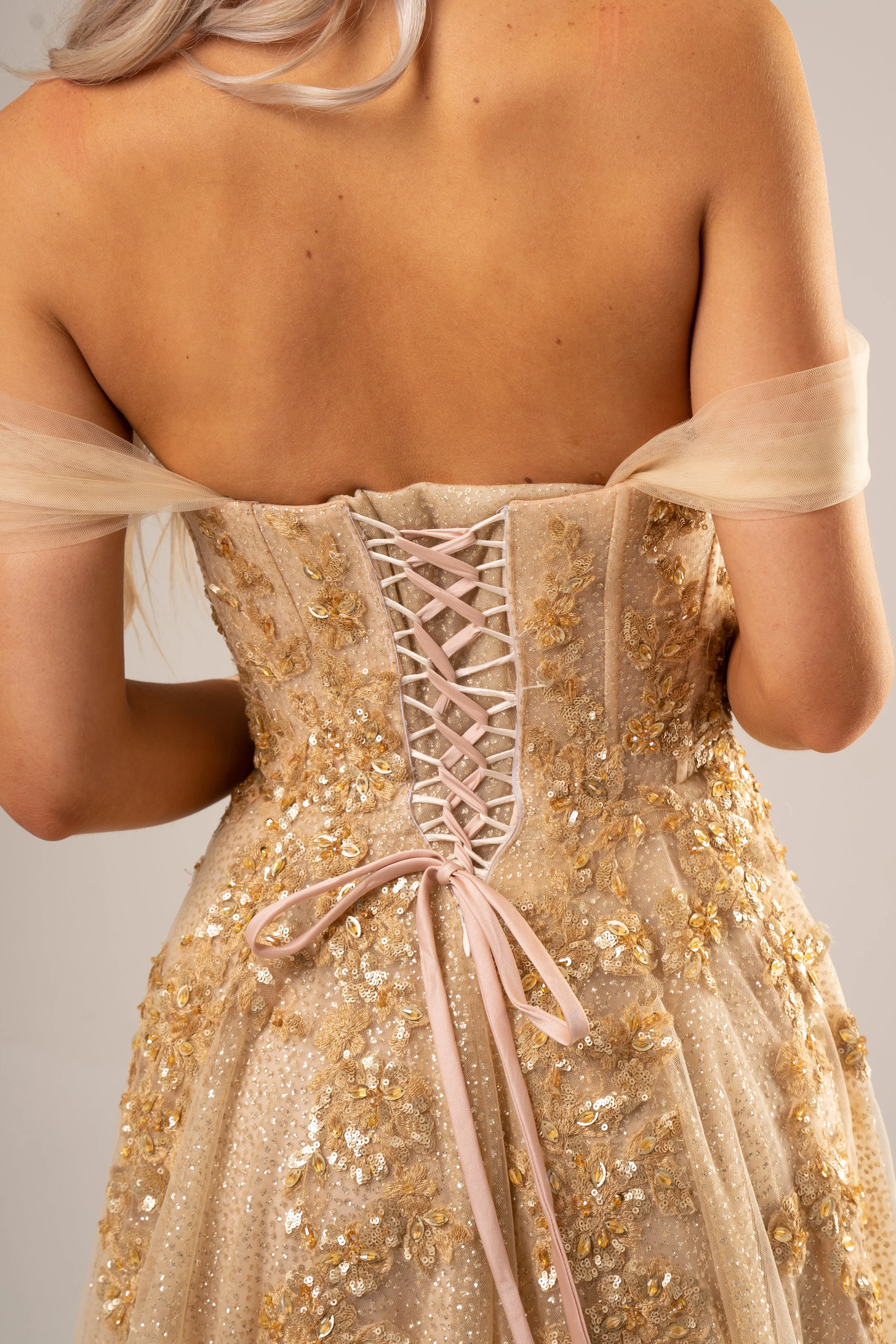 Sparkling gold bustier dress for hire